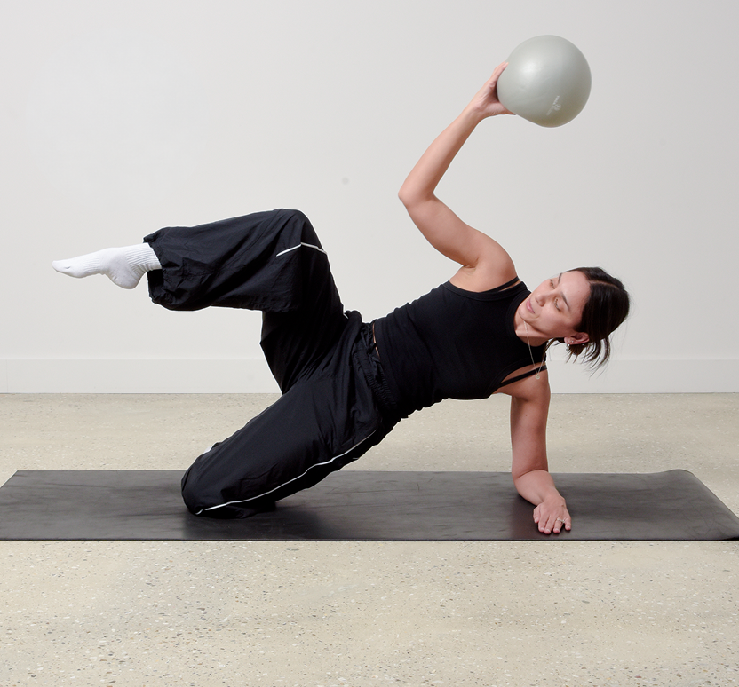 Mubeena demonstrating a Pilates side plank